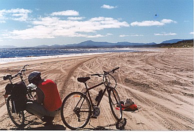 Cycling on Ocean Beach, Strahan, Tasmania, Australia